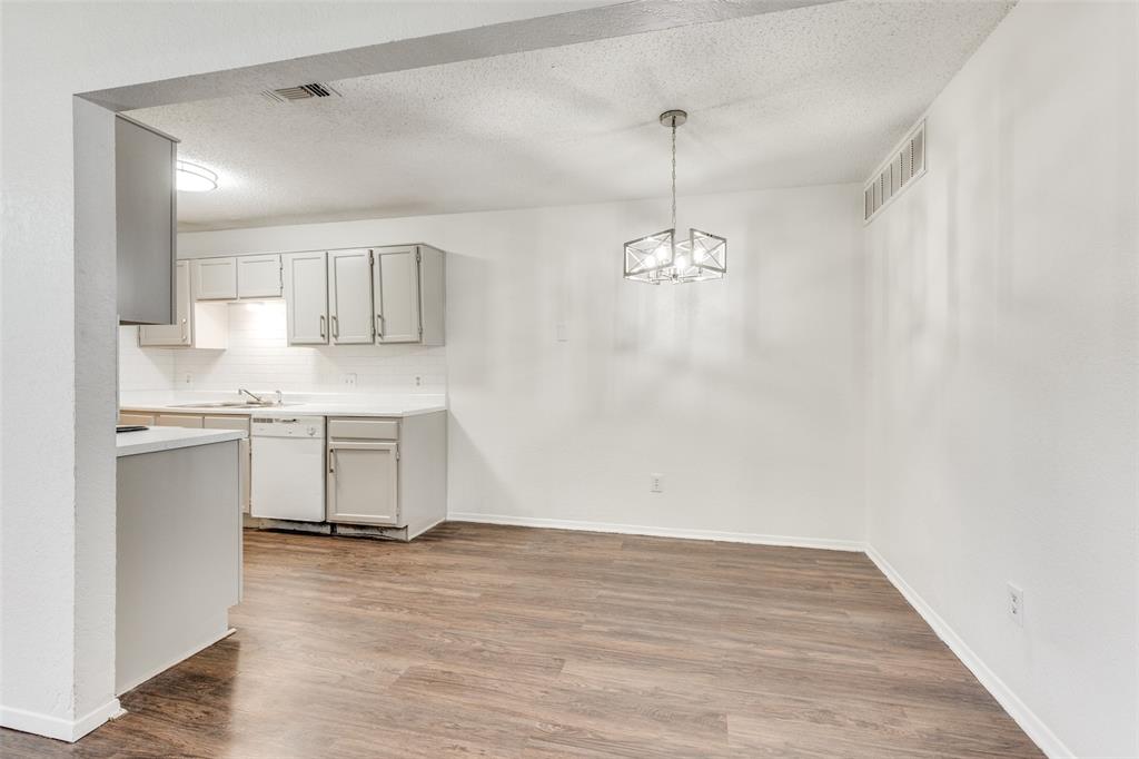 3624 Hulen Park Circle Fort Worth, TX 76123 - Photo 6 of 12 a view of a kitchen with a sink and dishwasher a refrigerator with wooden floor
