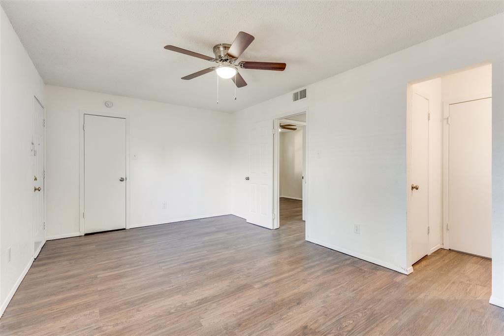 3624 Hulen Park Circle Fort Worth, TX 76123 - Photo 8 of 12 an empty room with wooden floor and windows