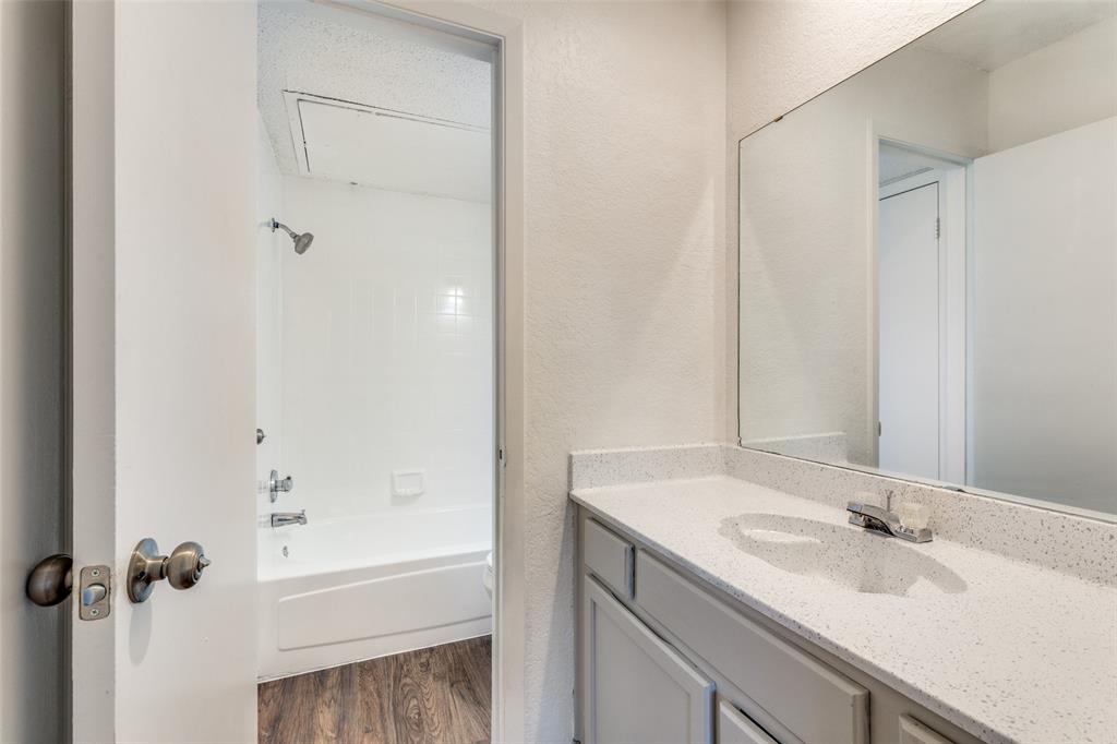 3624 Hulen Park Circle Fort Worth, TX 76123 - Photo 9 of 12 a bathroom with a granite countertop sink toilet and shower