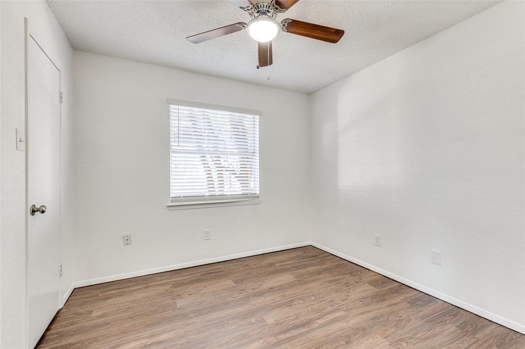 3624 Hulen Park Circle Fort Worth, TX 76123 - Photo 10 of 12 wooden floor in an empty room with a window