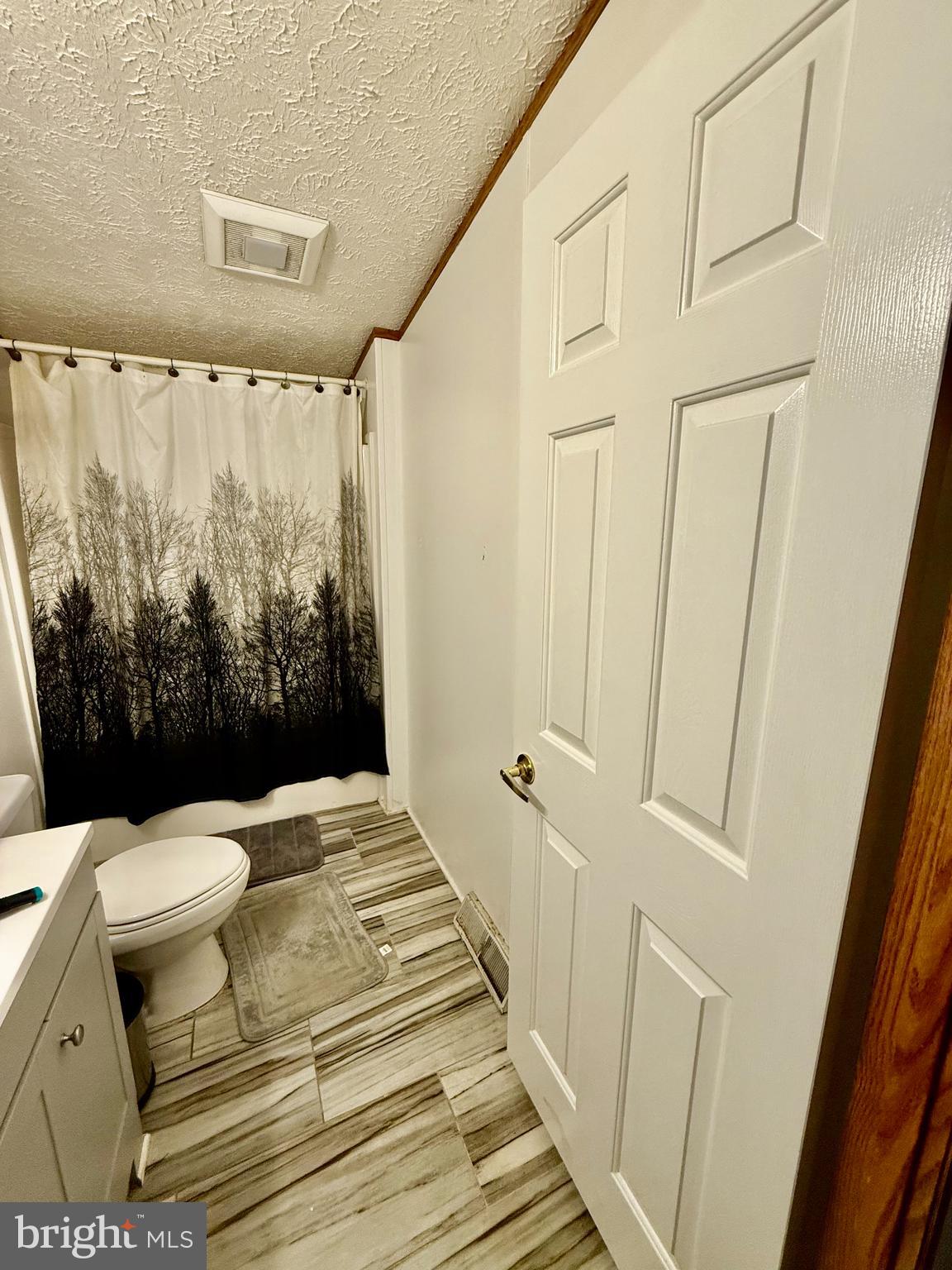 17858 Piney Point Road Tall Timbers, MD 20690 - Photo 4 of 4 a bathroom with a bathtub and shower