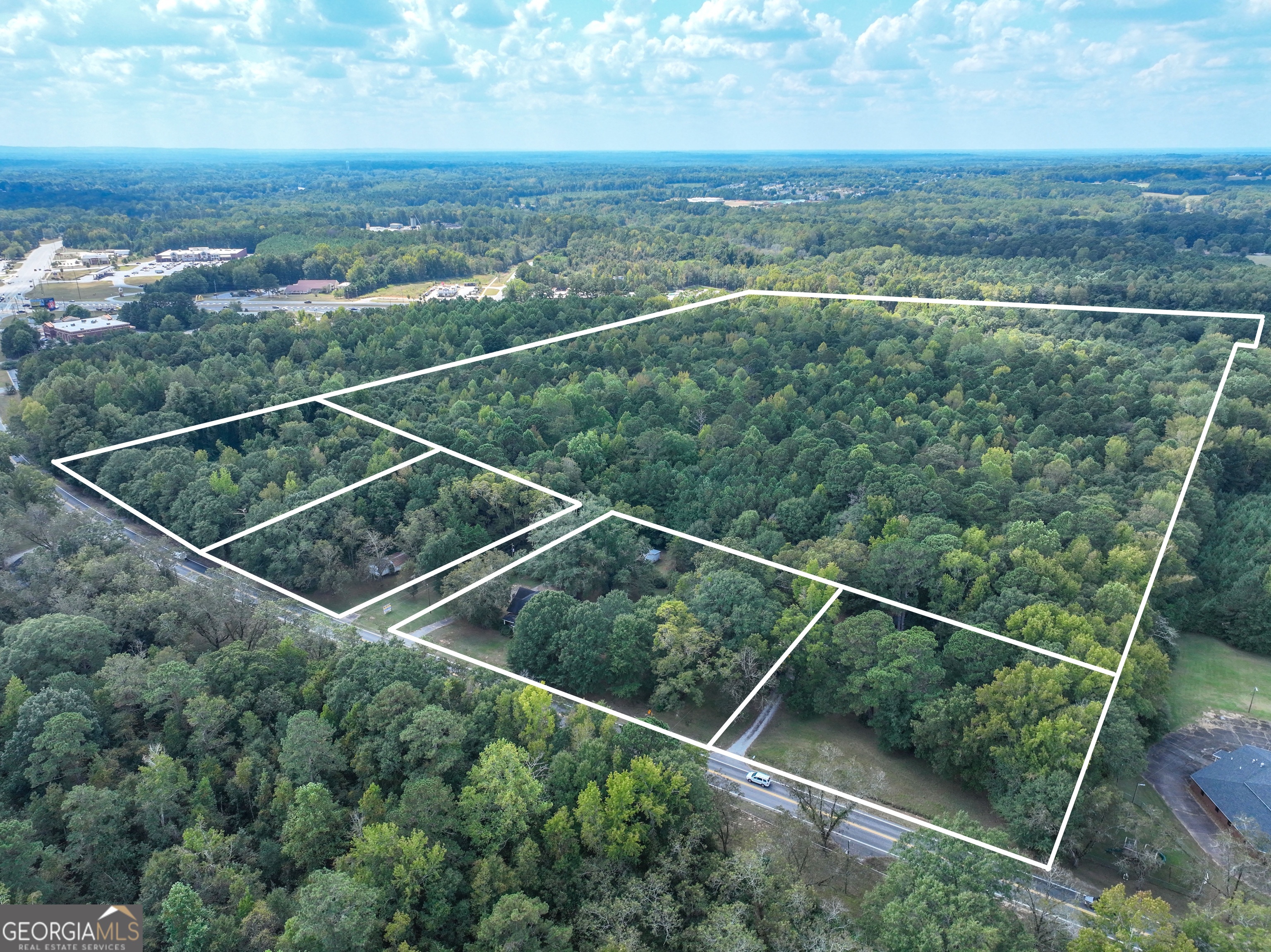 1541 Zebulon Road, Unit 4 TRACTS 35 ACRES Griffin, GA 30224 - Photo 21 of 26 a view of a balcony with an outdoor space