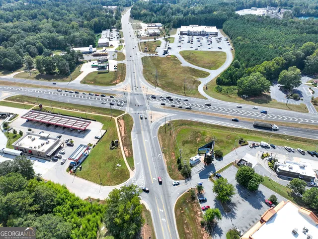 an aerial view of a swimming pool and outdoor space