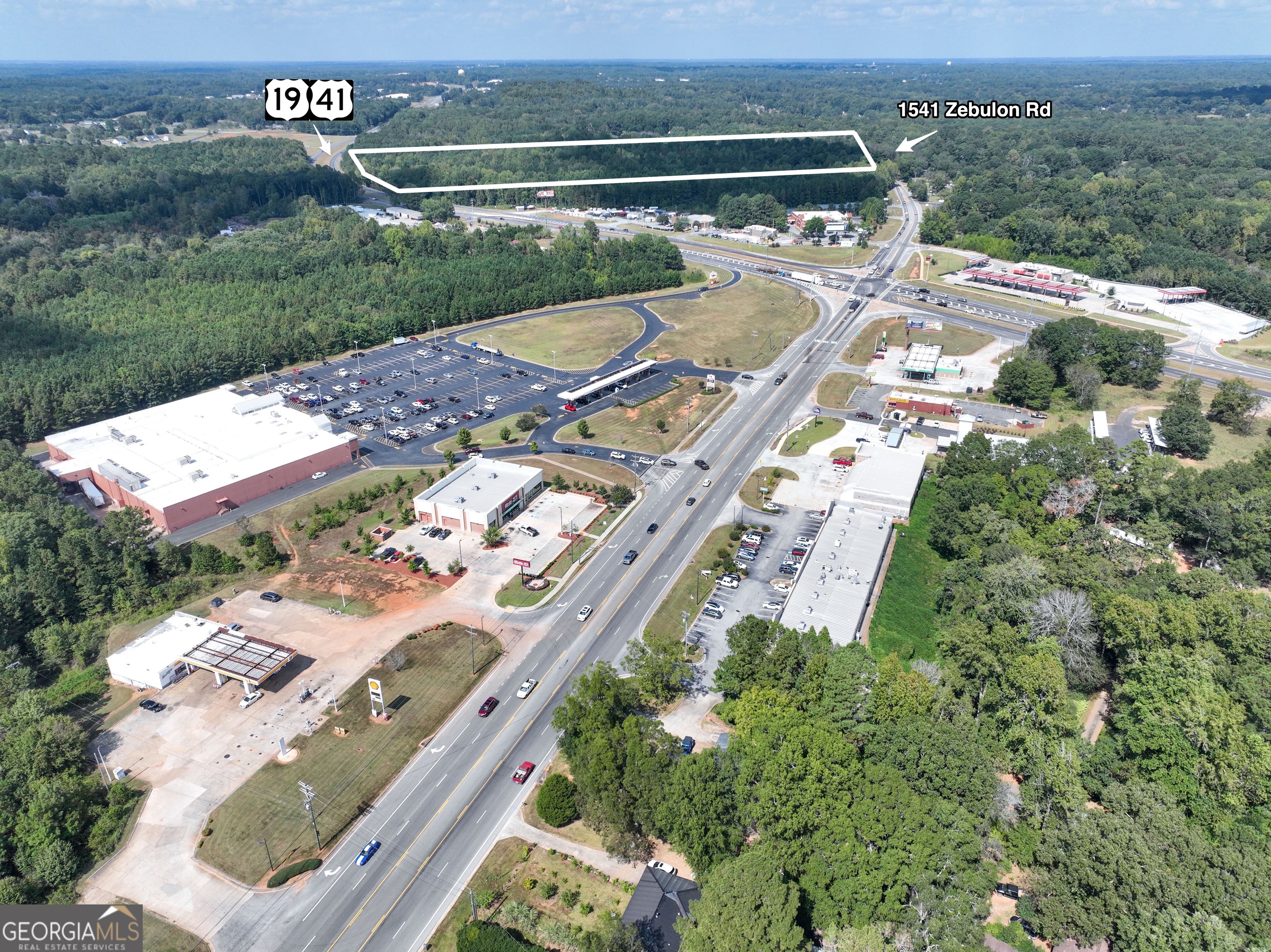 1541 Zebulon Road, Unit 4 TRACTS 35 ACRES Griffin, GA 30224 - Photo 5 of 26 an aerial view of a house with a garden