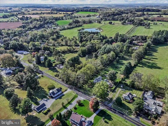an aerial view of a houses with outdoor space