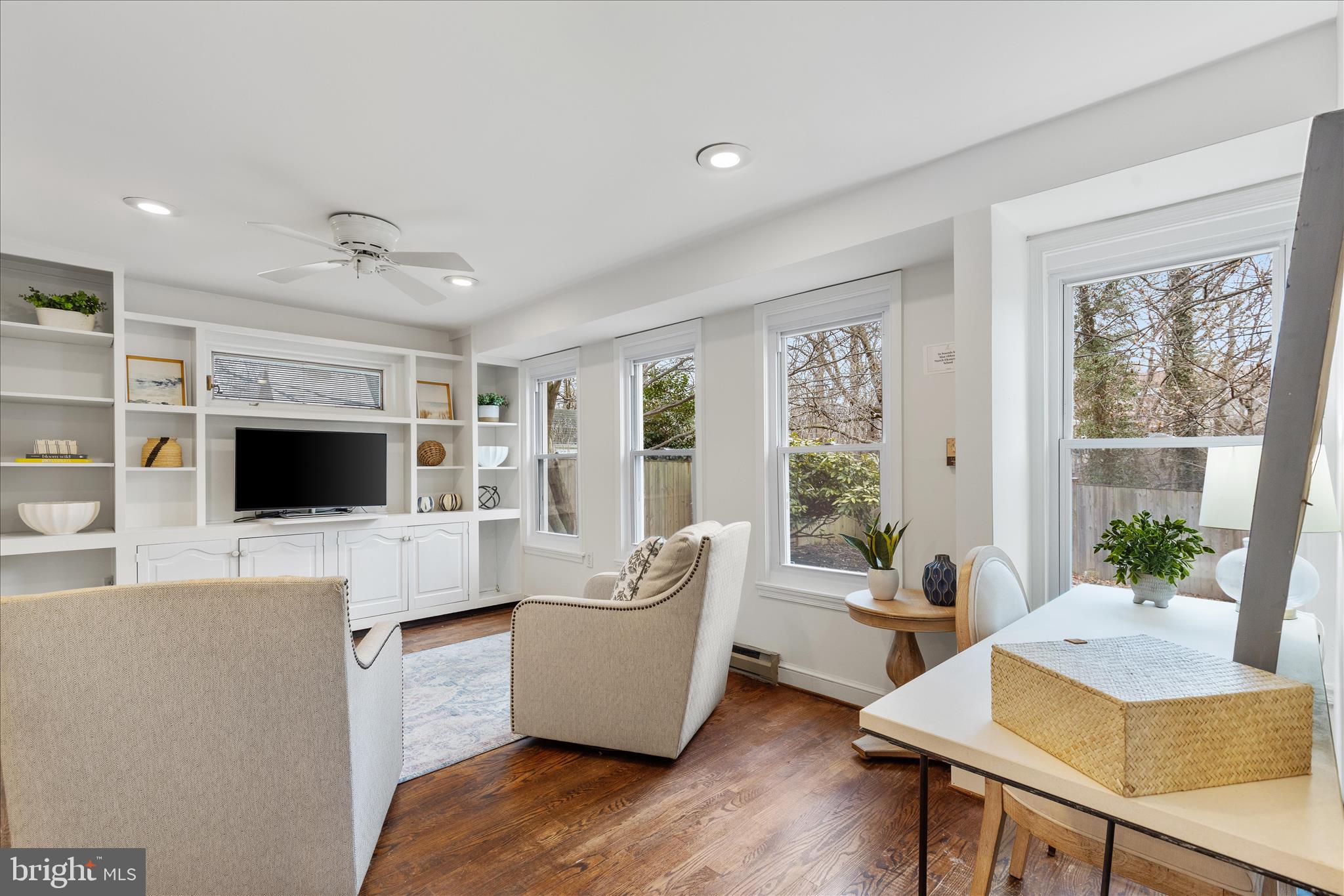 5352 29th Street Northwest Washington, DC 20015 - Photo 11 of 45 a living room with furniture and a flat screen tv