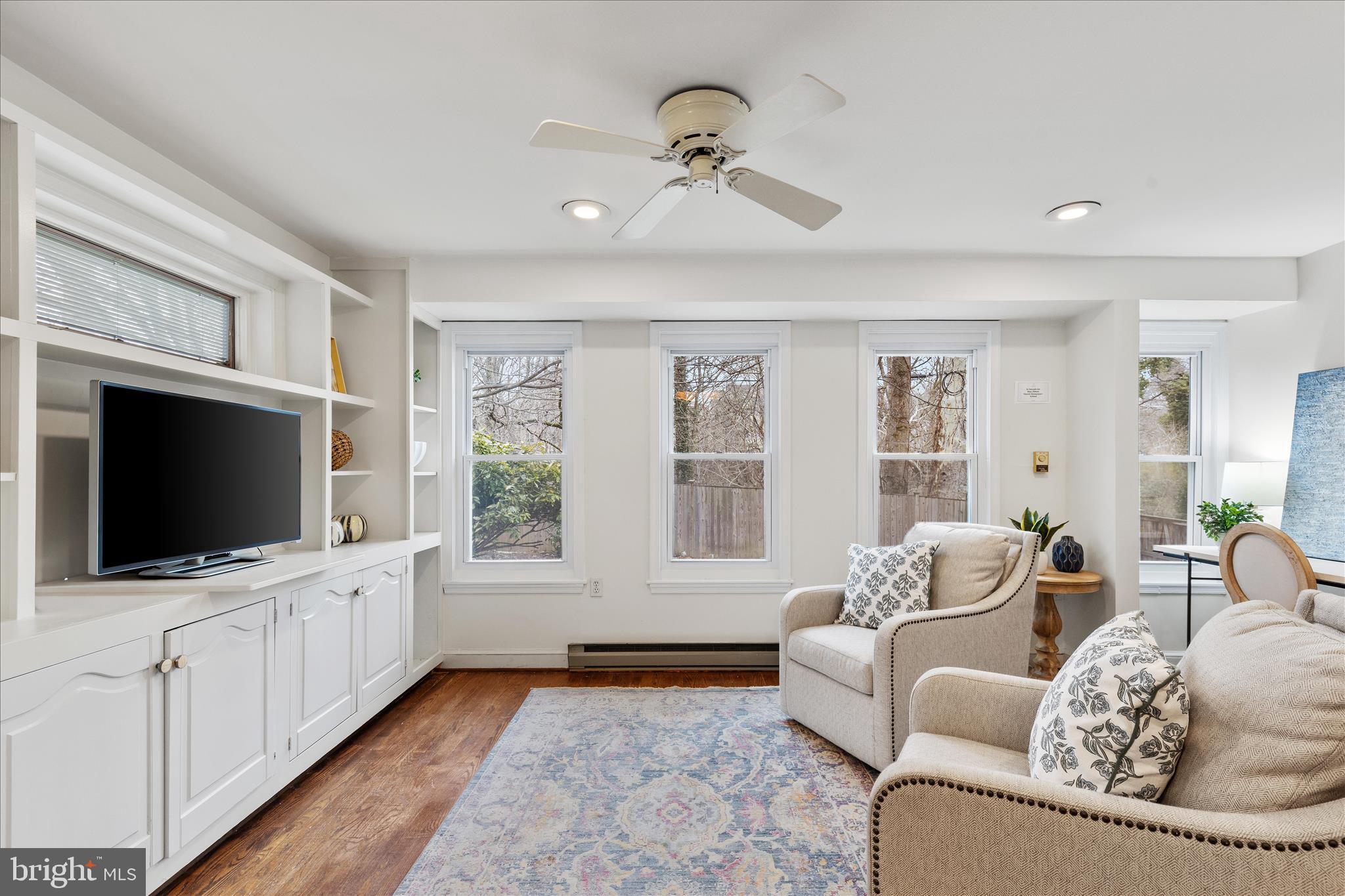 5352 29th Street Northwest Washington, DC 20015 - Photo 12 of 45 a living room with furniture and a flat screen tv