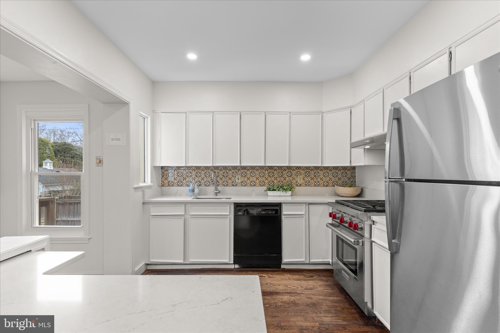 5352 29th Street Northwest Washington, DC 20015 - Photo 15 of 45 a kitchen with a refrigerator and a sink
