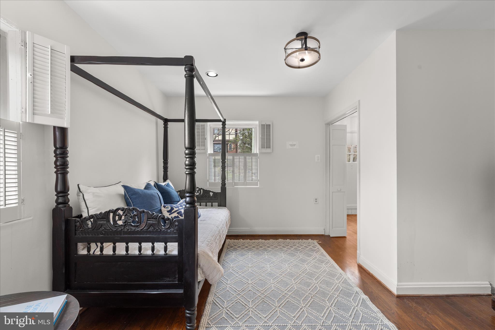 5352 29th Street Northwest Washington, DC 20015 - Photo 19 of 45 a view of a hallway with stairs and furniture