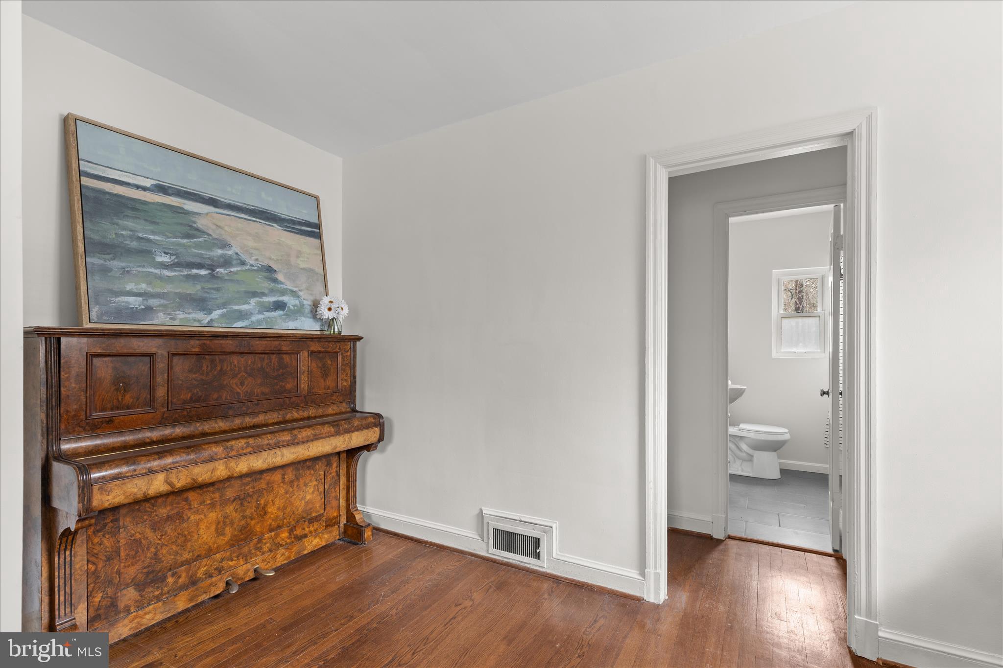 5352 29th Street Northwest Washington, DC 20015 - Photo 20 of 45 a view of a hallway with wooden floor and a bathroom