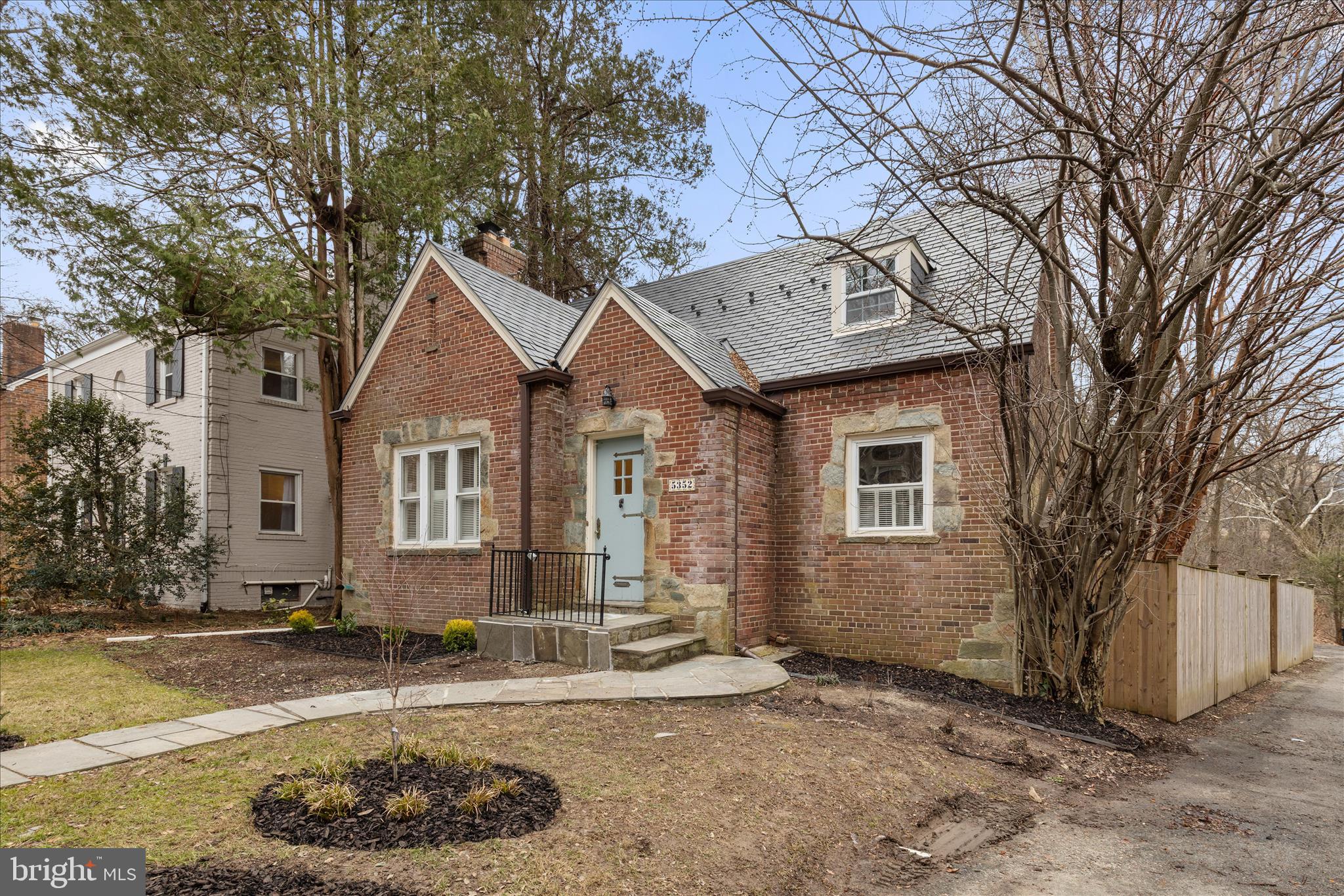 5352 29th Street Northwest Washington, DC 20015 - Photo 2 of 45 a front view of a house with a yard