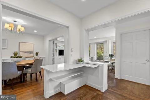 a kitchen with a stove a refrigerator and a sink