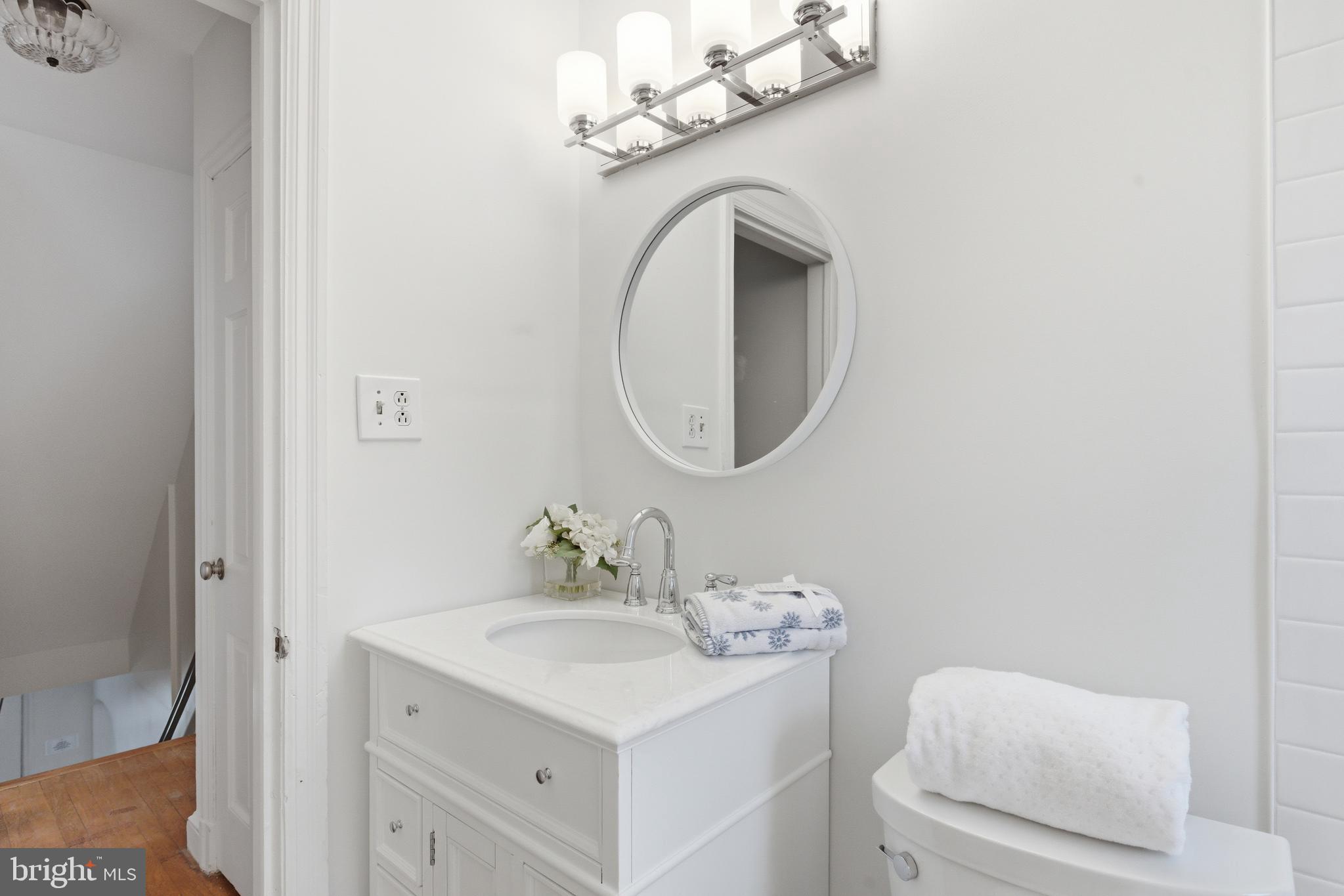 5352 29th Street Northwest Washington, DC 20015 - Photo 26 of 45 a bathroom with a sink and a mirror