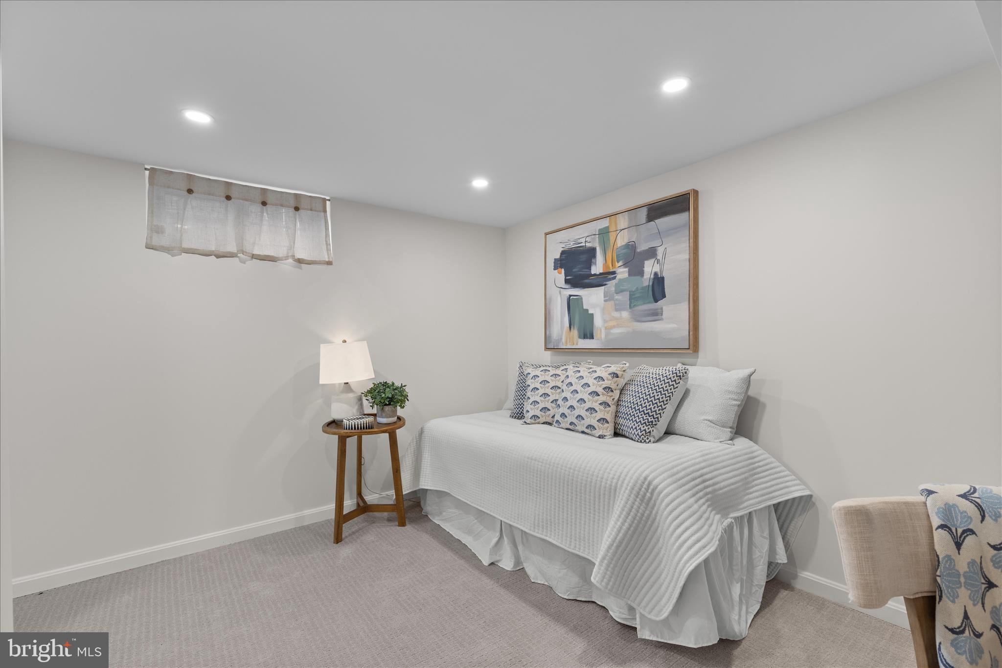 5352 29th Street Northwest Washington, DC 20015 - Photo 36 of 45 a bed room with a bed and a painting