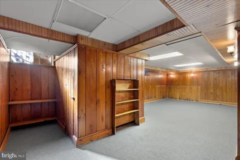 a view of an empty room with a cabinet