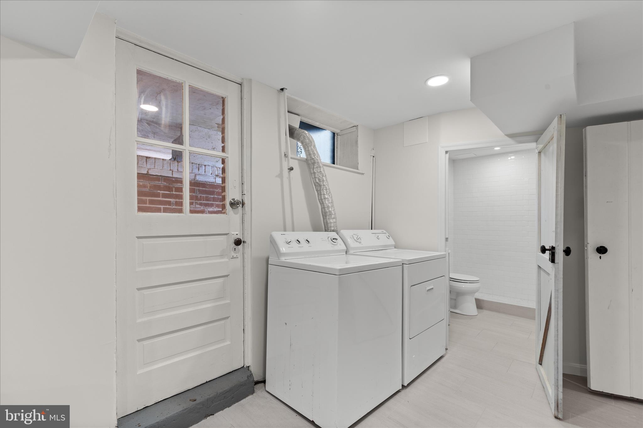5352 29th Street Northwest Washington, DC 20015 - Photo 39 of 45 a bathroom with a sink a toilet and shower