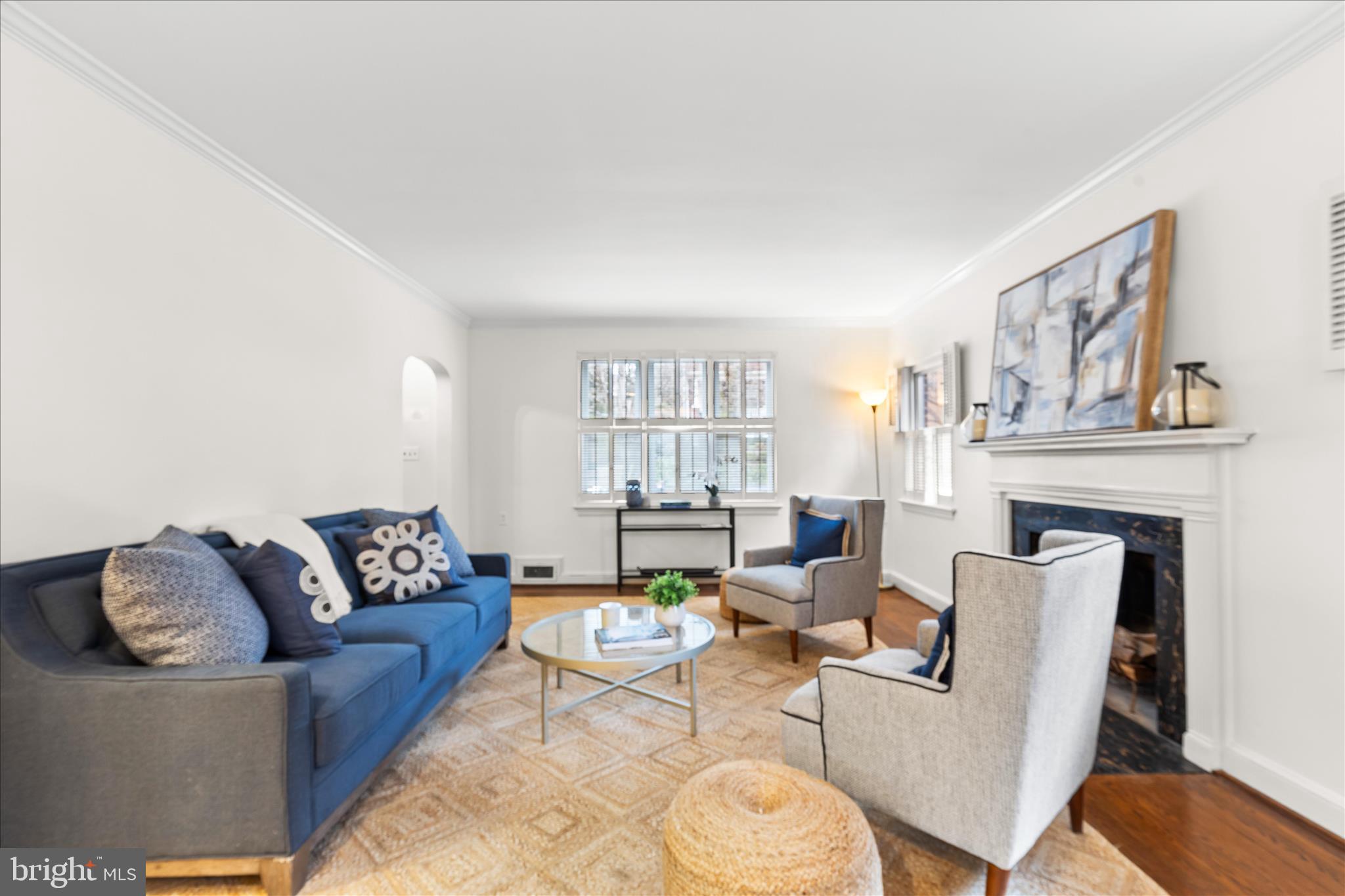 5352 29th Street Northwest Washington, DC 20015 - Photo 5 of 45 a living room with furniture a fireplace and window