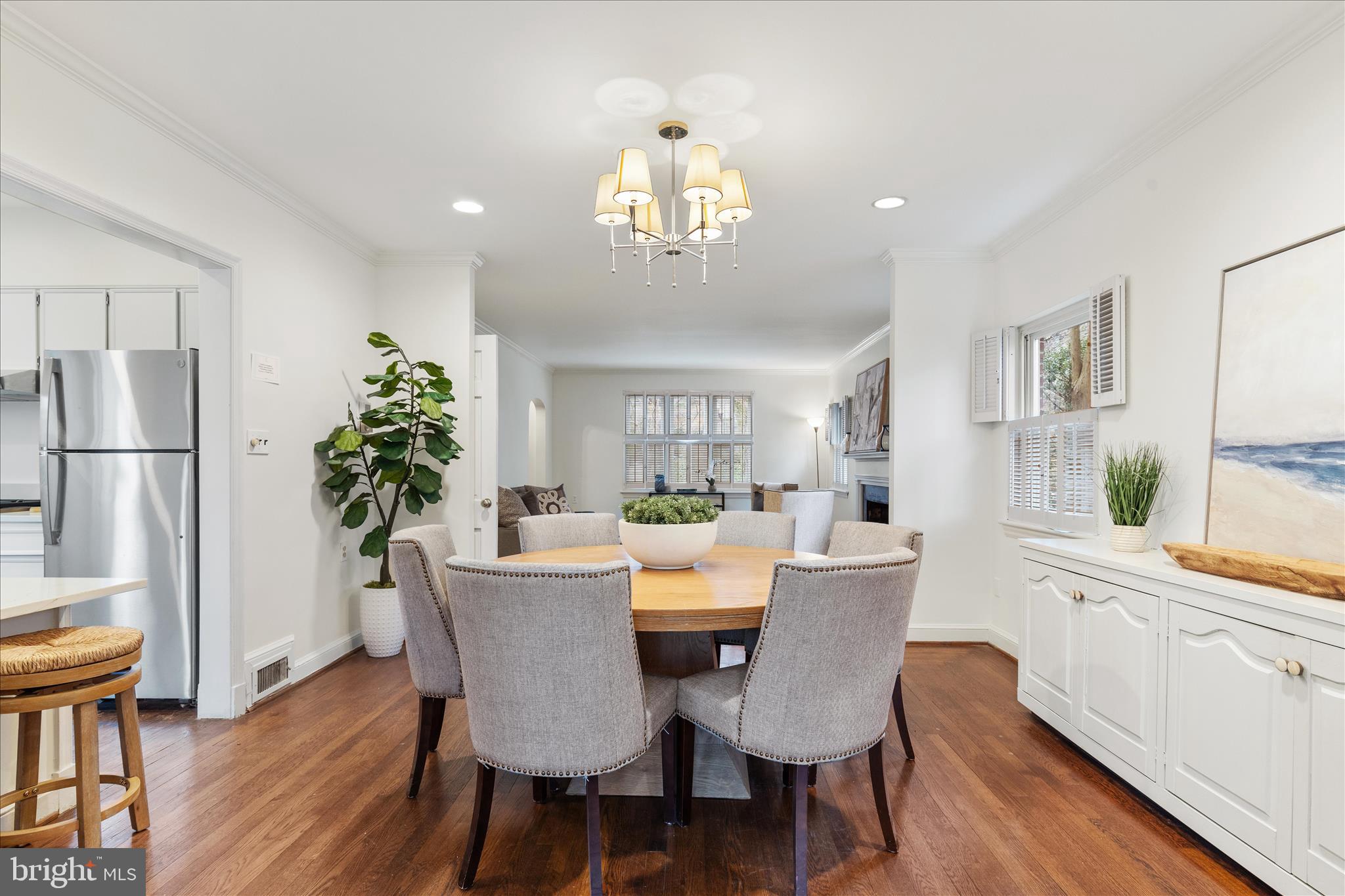 5352 29th Street Northwest Washington, DC 20015 - Photo 9 of 45 a dining room with furniture a chandelier and wooden floor