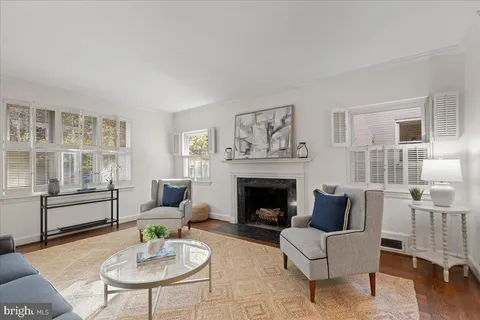 a living room with furniture or couch and a fireplace