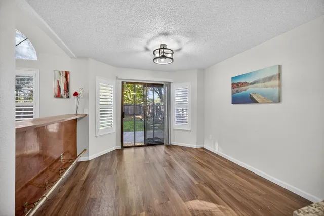 a view of an entryway with wooden floor