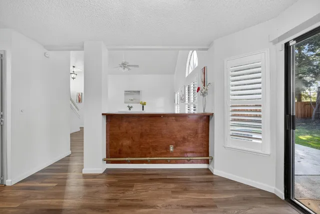 a view of room with window and wooden floor