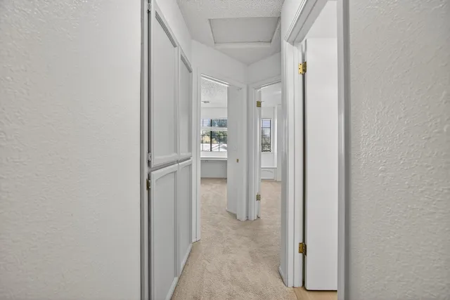 a view of a bathroom from a hallway
