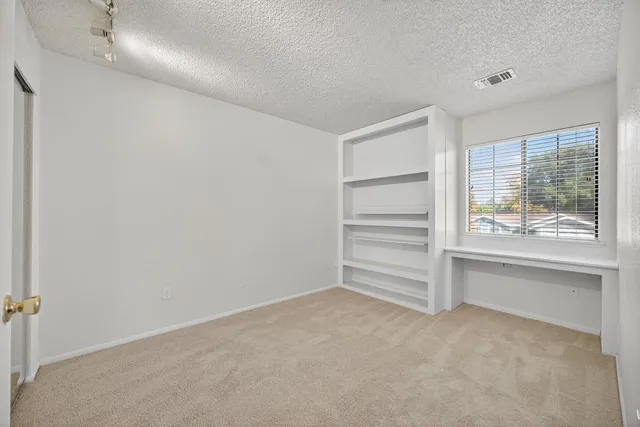 a view of an empty walk in closet