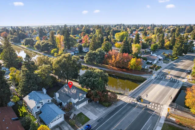 an aerial view of house with yard swimming pool and outdoor seating
