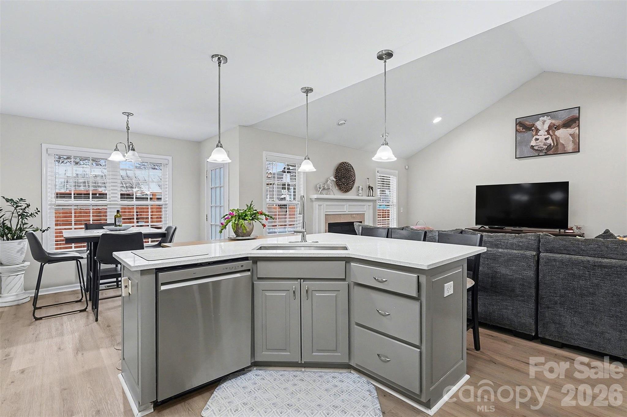 202 East 27th Street Kannapolis, NC 28083 - Photo 11 of 29 a large kitchen with kitchen island a sink a stove and a couch