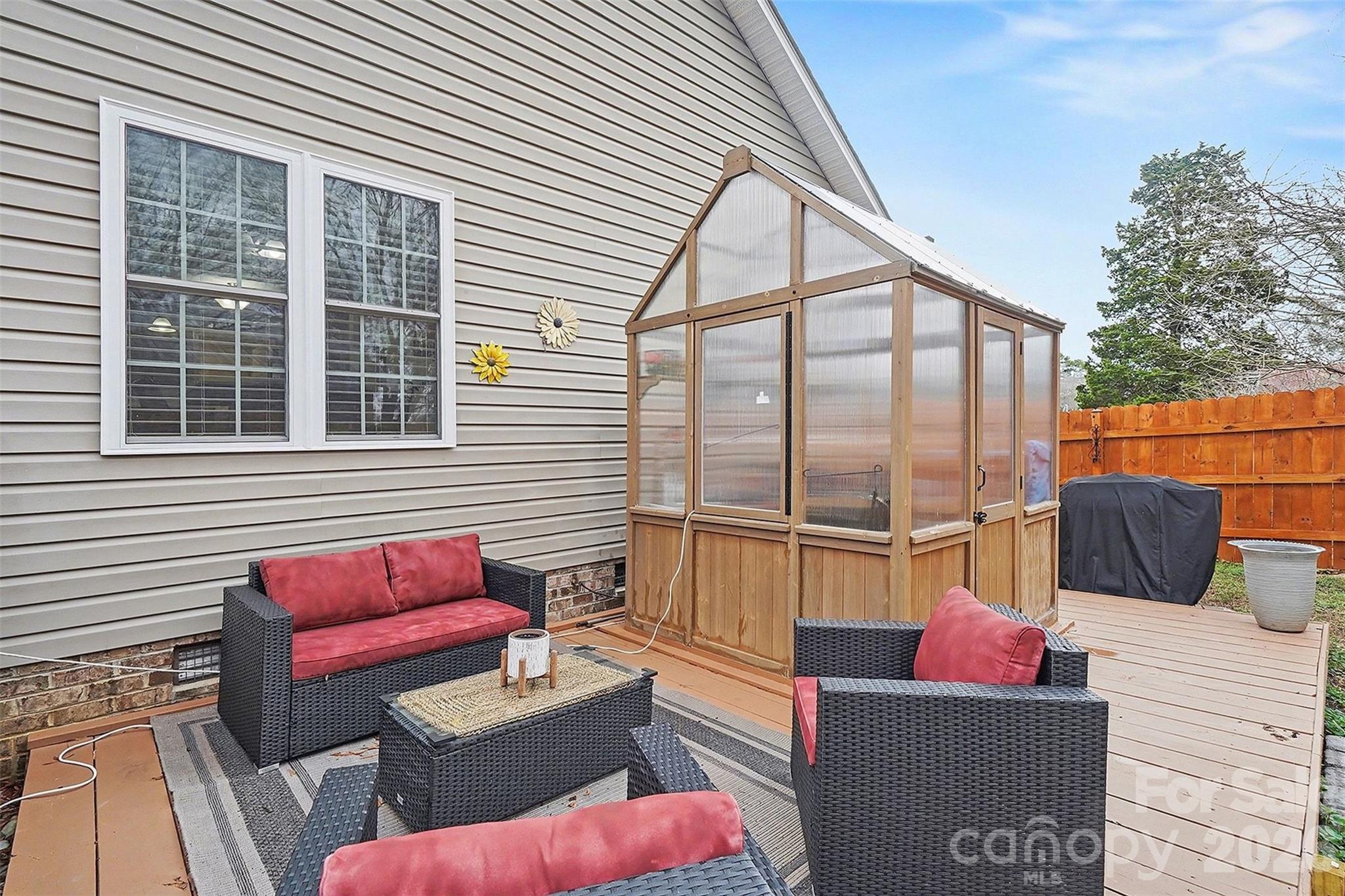 202 East 27th Street Kannapolis, NC 28083 - Photo 27 of 29 a outdoor space with patio the couches and a potted plant on a table