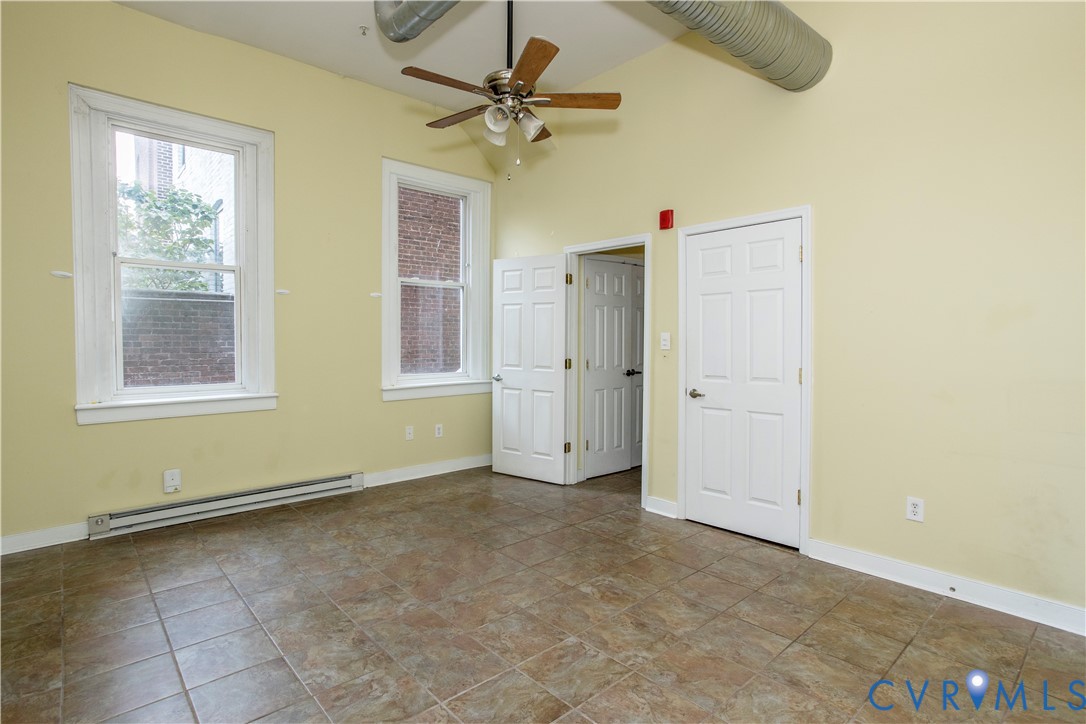 1012 West Franklin Street Richmond, VA 23220 - Photo 11 of 27 an empty room with windows and fan