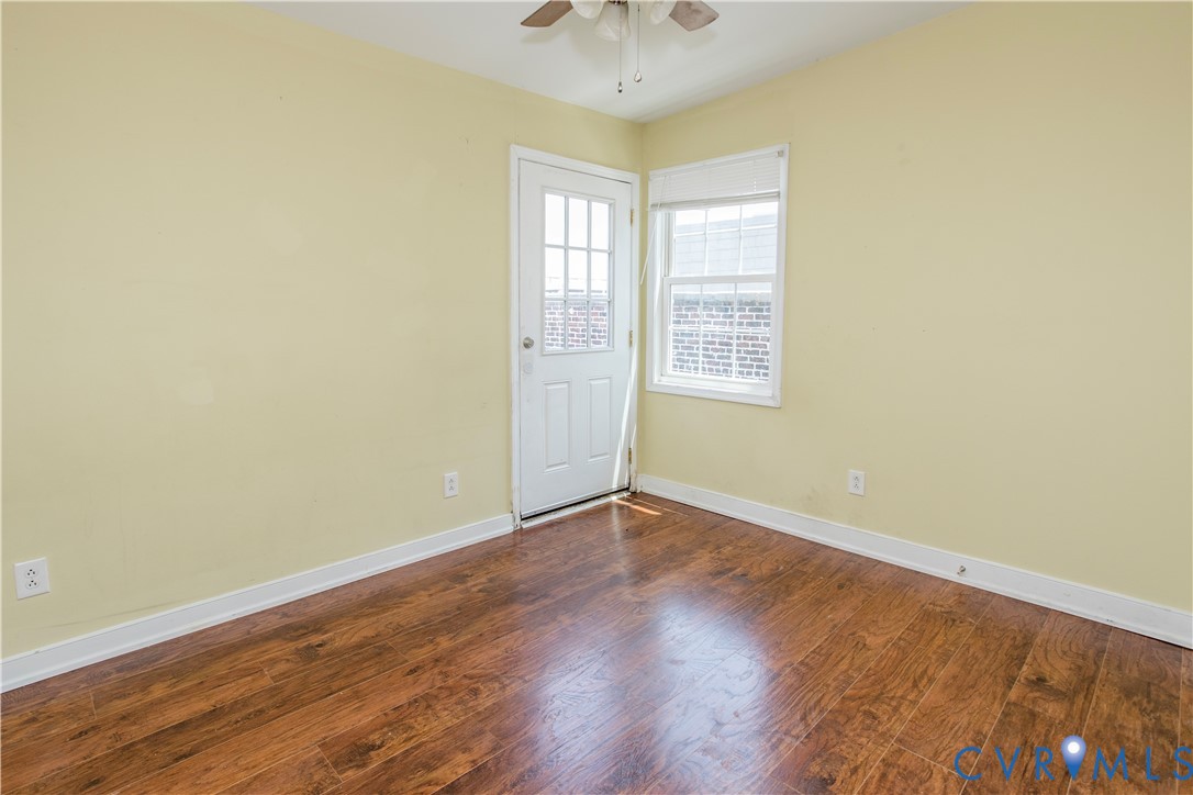 1012 West Franklin Street Richmond, VA 23220 - Photo 14 of 27 an empty room with wooden floor and windows