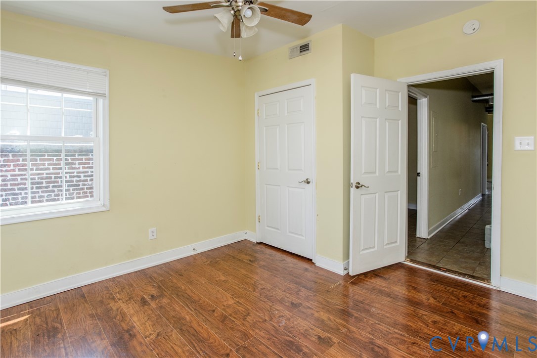 1012 West Franklin Street Richmond, VA 23220 - Photo 15 of 27 wooden floor in an empty room with a window