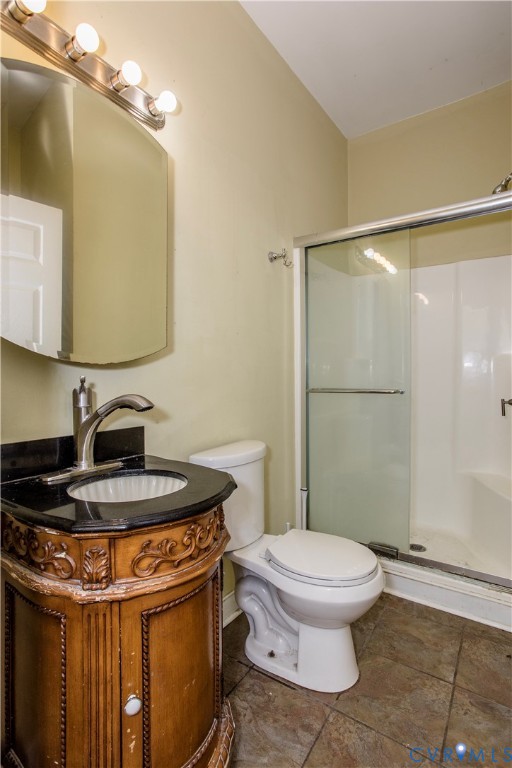 1012 West Franklin Street Richmond, VA 23220 - Photo 16 of 27 a bathroom with a sink a toilet a mirror and shower