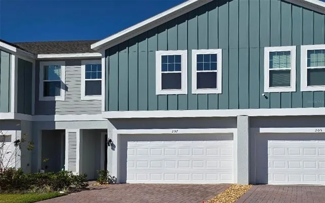a view of brick building with large windows
