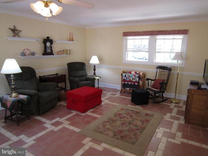 9204 Lawnview Lane Laurel, MD 20708 - Photo 16 of 24 Terra Cotta Floor highlights Family Room and Kit
