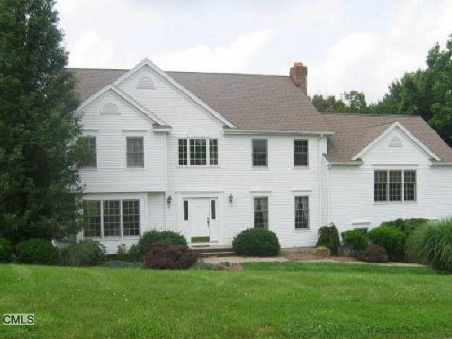 9 Yogananda Street Newtown, CT 06482 - Photo 1 of 1 a front view of a house with a yard
