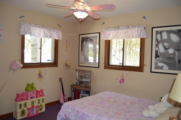 995 Ruth Drive Elgin, IL 60123 - Photo 12 of 23 a bedroom with a bed dresser and a window