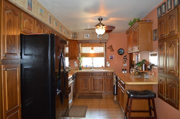 995 Ruth Drive Elgin, IL 60123 - Photo 6 of 23 a kitchen with stainless steel appliances granite countertop a sink refrigerator and cabinets