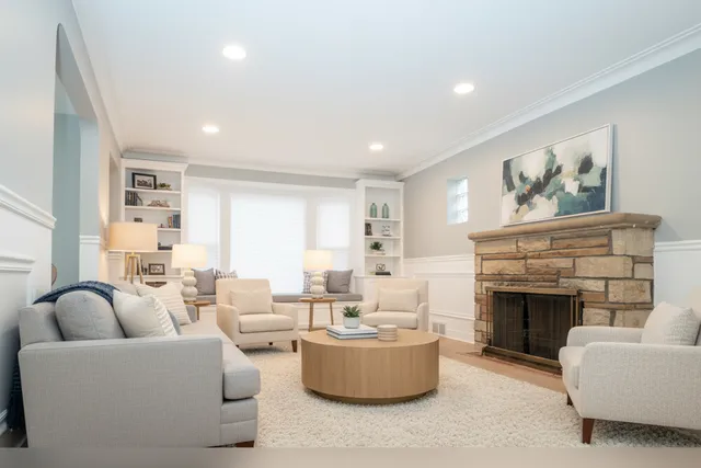 a living room with furniture and a fireplace