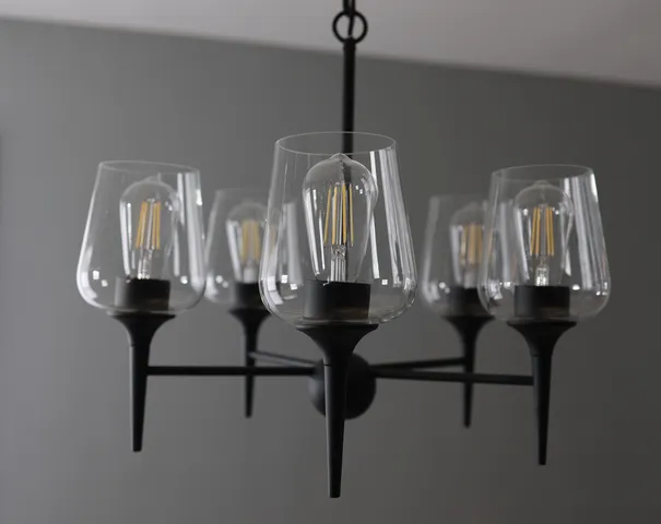 a view of dining room with furniture and chandelier