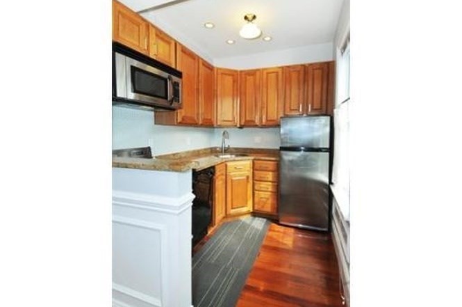 613-615 Dorchester Avenue, Unit 2 Boston, MA 02127 - Photo 6 of 12 a kitchen with a sink cabinets and microwave