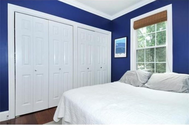 613-615 Dorchester Avenue, Unit 2 Boston, MA 02127 - Photo 8 of 12 a bedroom with a bed and a window