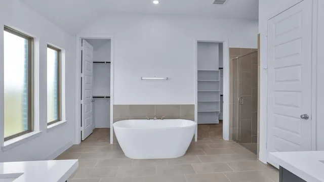 a white bath tub sitting in a bathroom