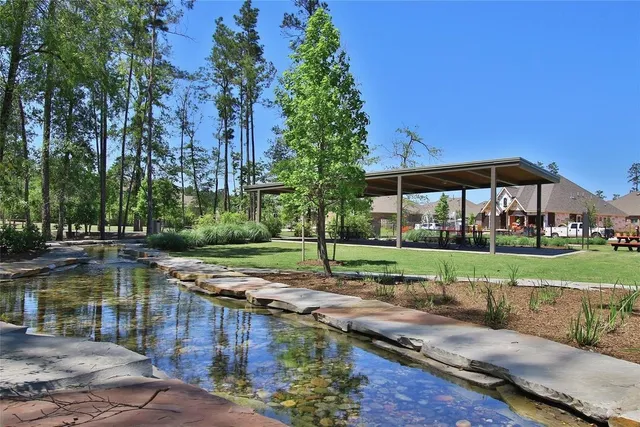 an aerial view of a house with yard and outdoor seating