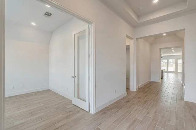a view of entryway with wooden floor