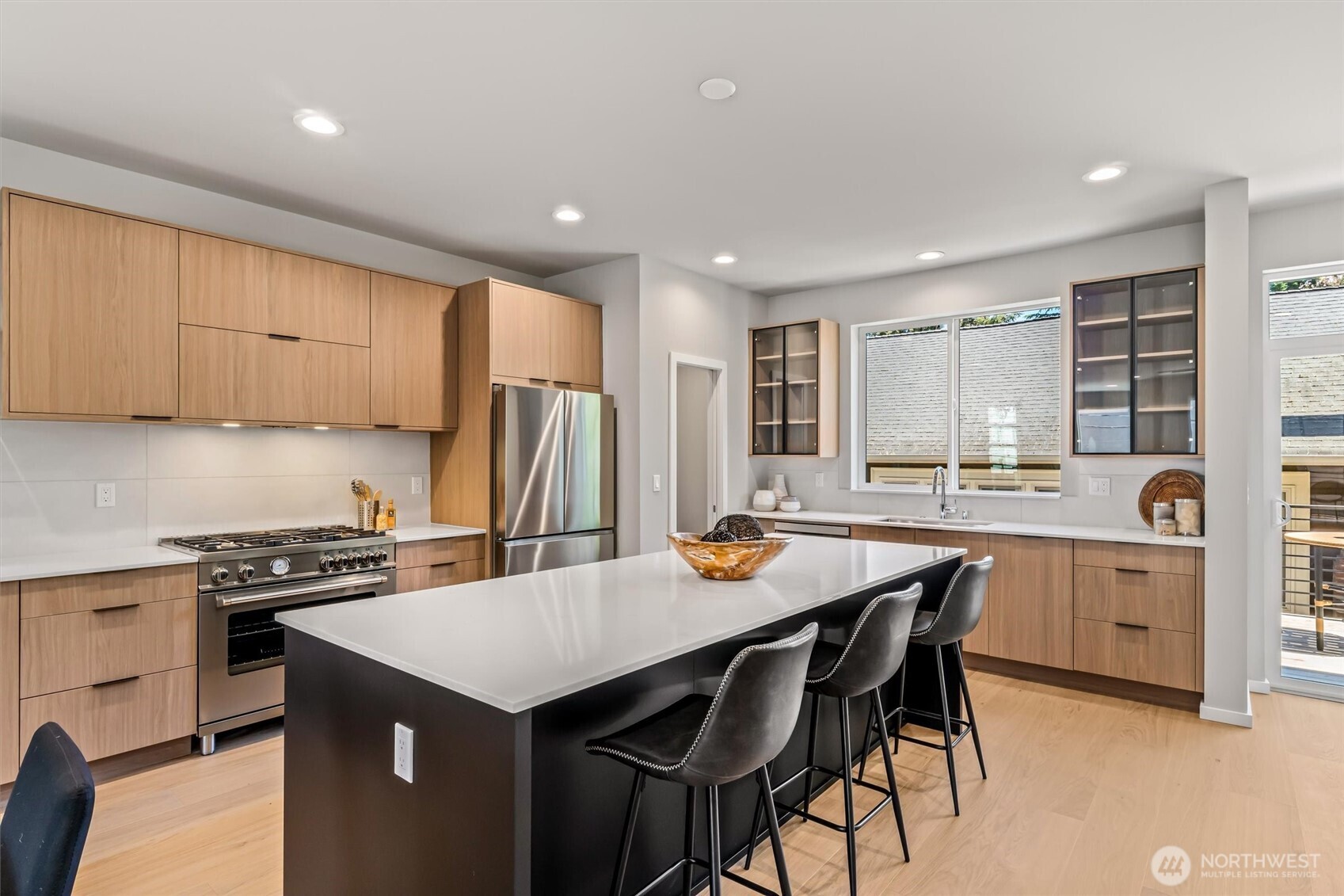 4460 Midvale Avenue North Seattle, WA 98103 - Photo 10 of 40 a kitchen with a stove a refrigerator and a sink