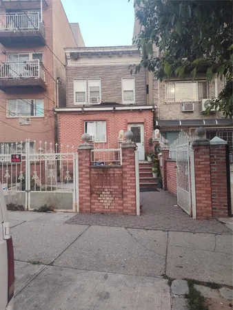a view of a brick building with many windows