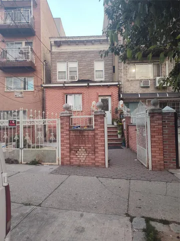 a view of a brick building with many windows