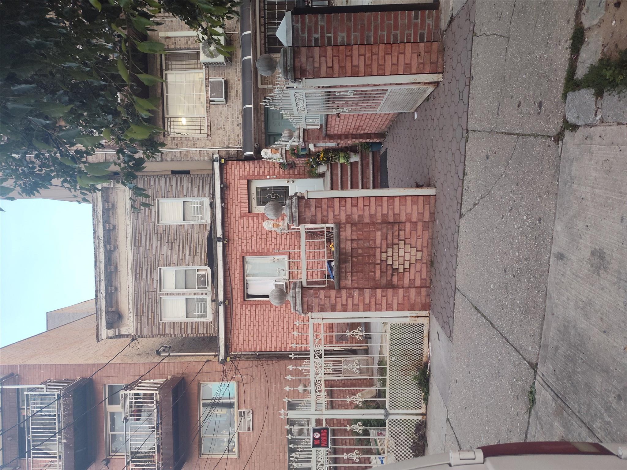 109-16 34th Avenue Queens, NY 11368 - Photo 1 of 1 a view of a brick building with many windows